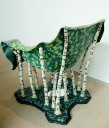 This a mixed media chair, with a mirror as a lake.